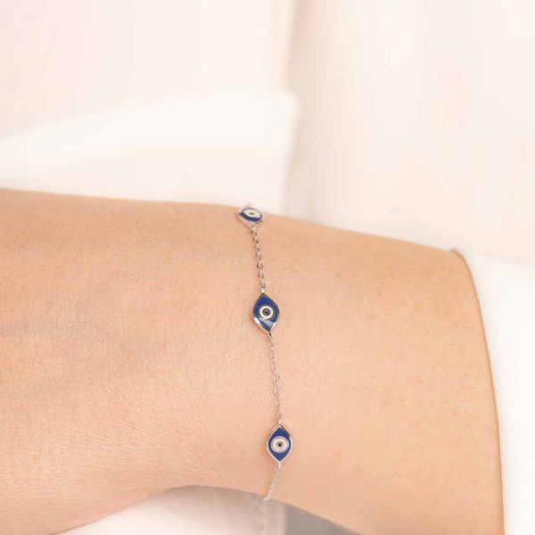 silver bracelet with blue evil eyes and enamel