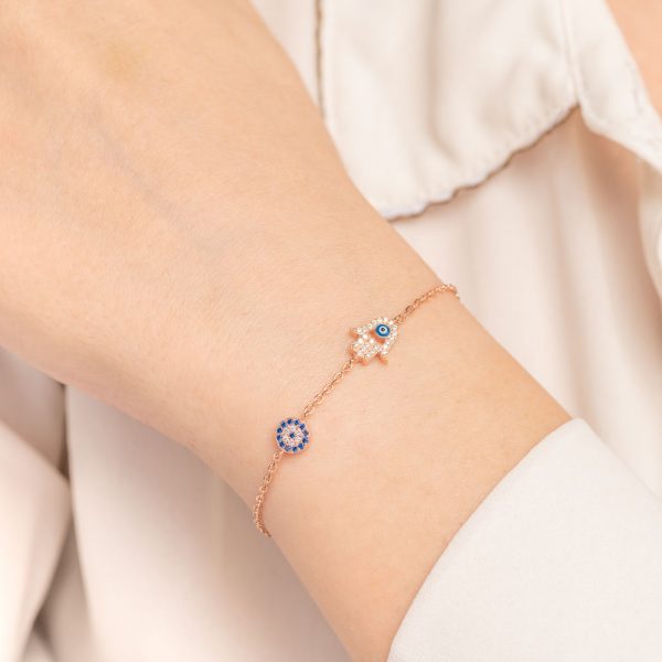 silver bracelet with evil eye and hand of Fatima