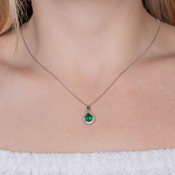 silver mentagion green rosette solitaire pear-shaped