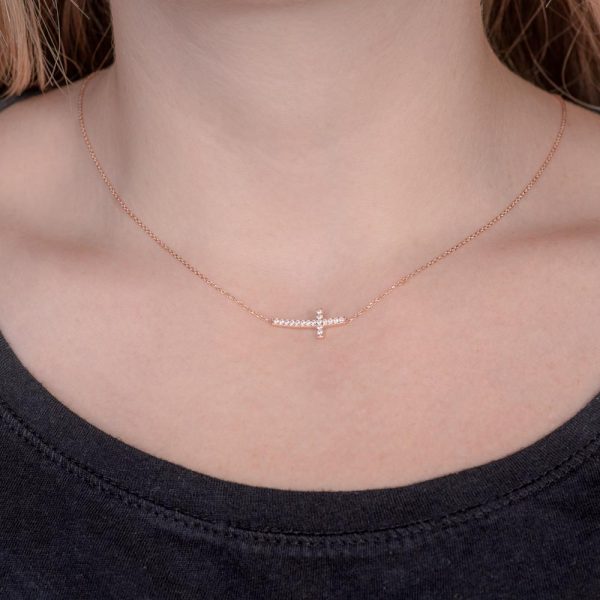 silver necklace with curved cross